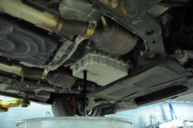 2009 Maserati Granturismo 4.7 Black oil change naperville chicago filter BMC Cleaning Service Maintenance pan draining plug removed under car