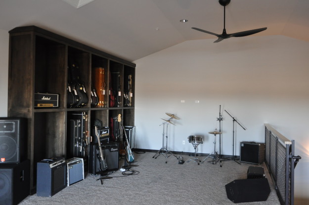 iron gate motor condo third floor guitar collection customized amps shelf drum set